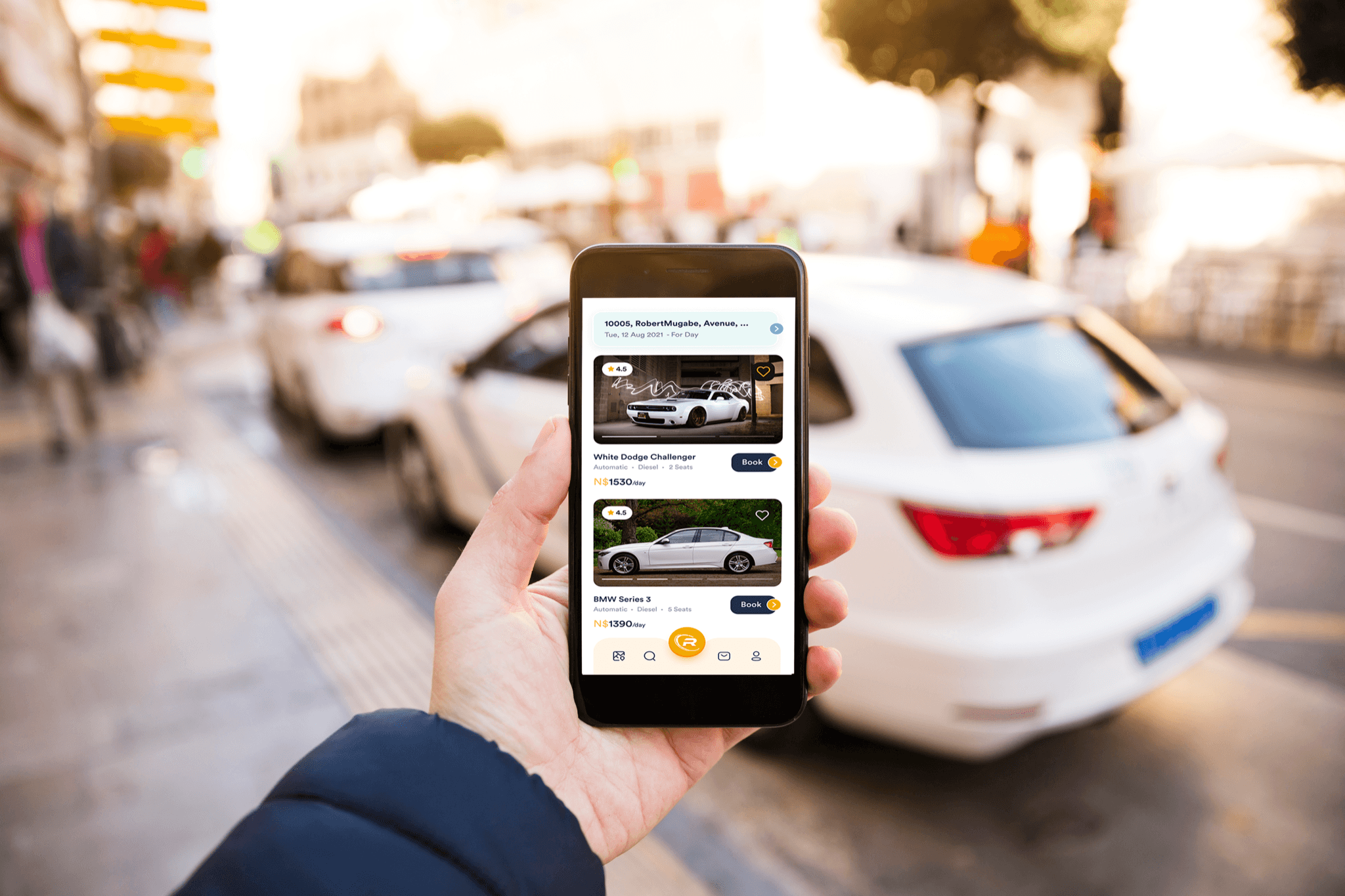 RentedWheels mobile app showing car listings on the go