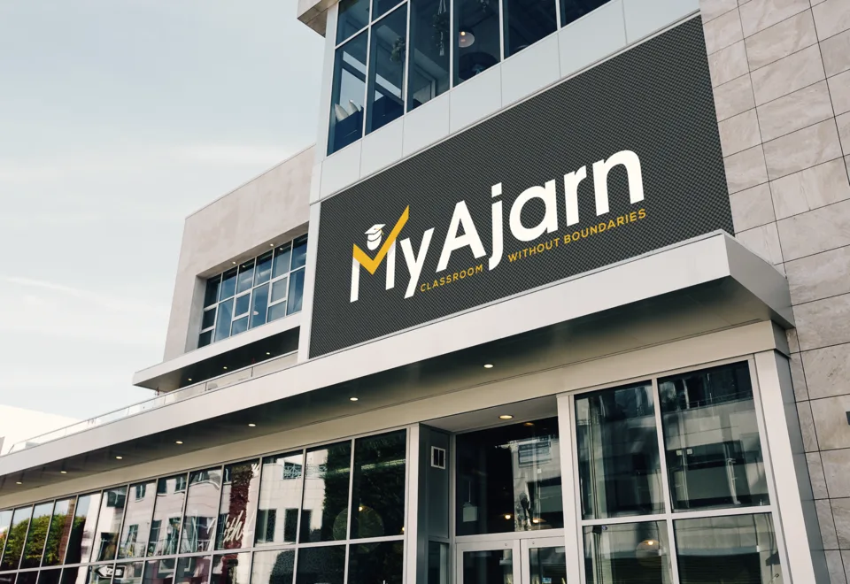 The MyAjarn logo on a building sign
