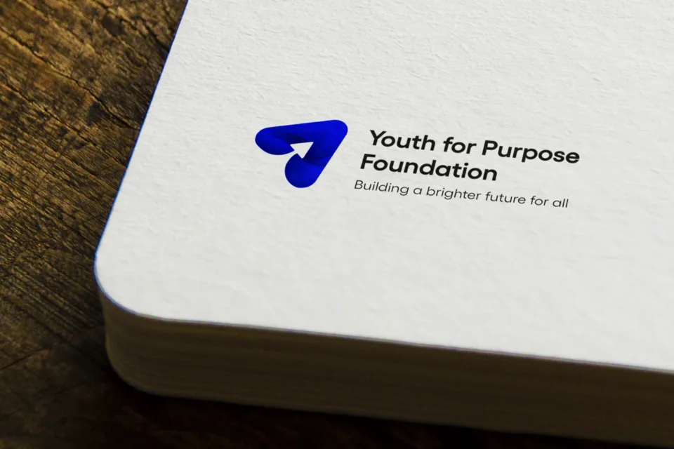 The Youth For Purpose Foundation logo on a notebook