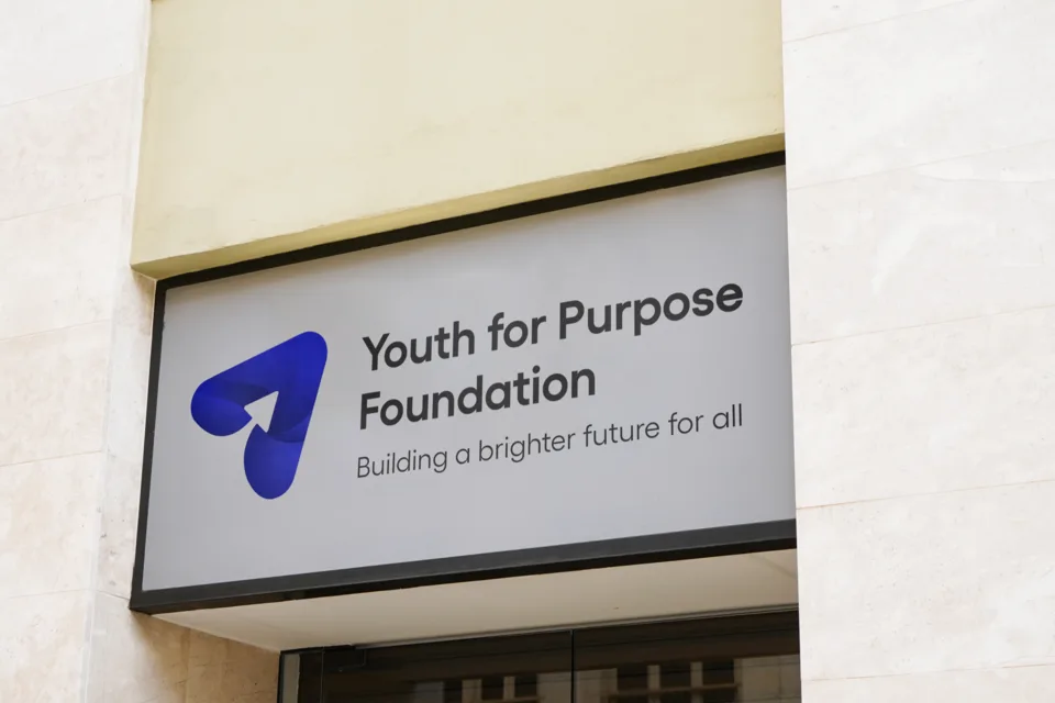 The Youth For Purpose Foundation logo on a building sign